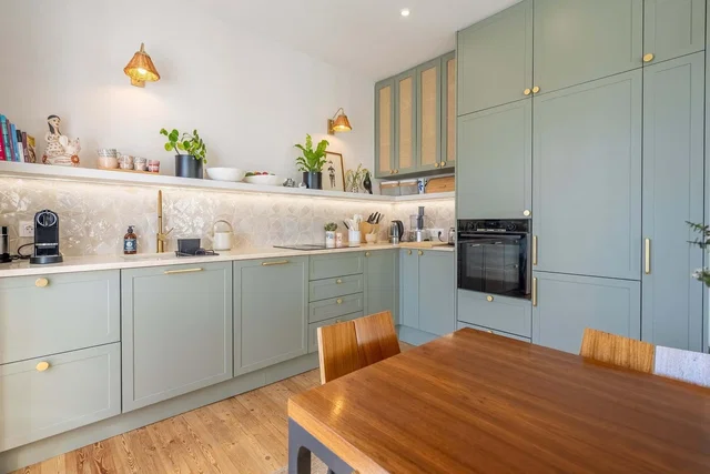 Kitchen; kitchen appliances, wood floor, natural light, modern style, renovated