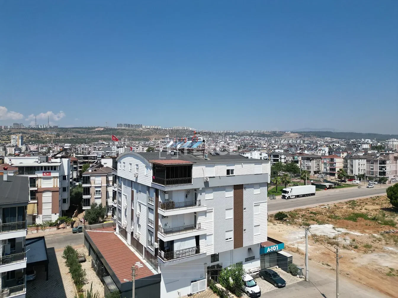 House and surroundings; view