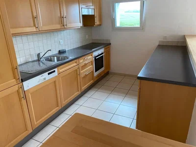 Kitchen; kitchen appliances, tile floor, natural light