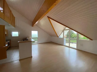 Living room; natural light, wood beams, tile floor