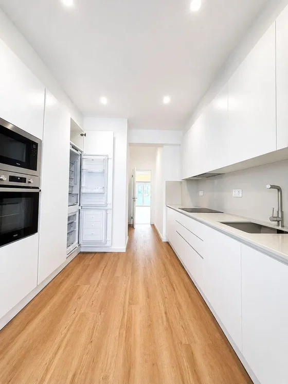 Kitchen; kitchen appliances, wood floor, natural light, renovated
