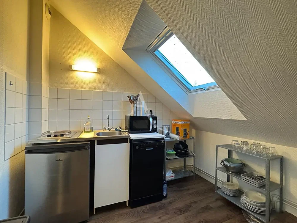 Kitchen; kitchen appliances, tile floor, natural light