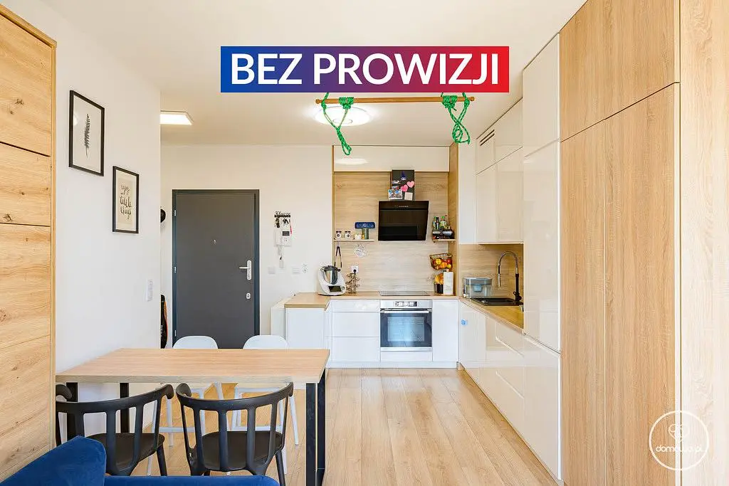 Kitchen; kitchen appliances, wood floor, natural light, modern style