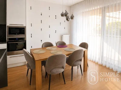 Kitchen; kitchen appliances, wood floor, natural light, modern style