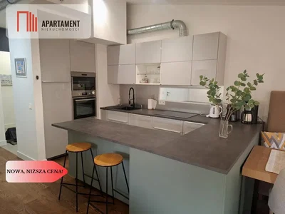Kitchen; kitchen appliances, tile floor, natural light