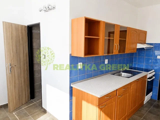 Kitchen; kitchen appliances, tile floor, natural light