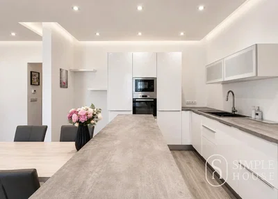Kitchen; kitchen appliances, wood floor, renovated, natural light