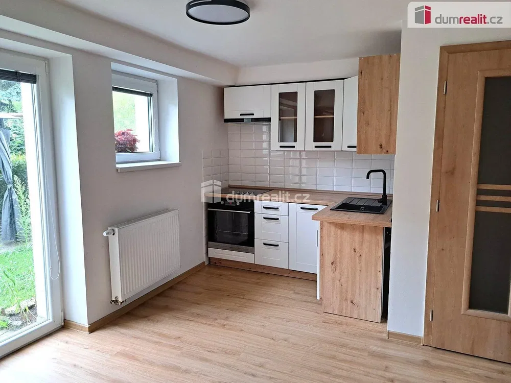 Kitchen; kitchen appliances, natural light, wood floor