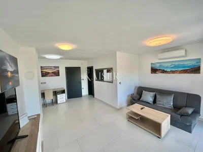 Living room; natural light, tile floor, modern style