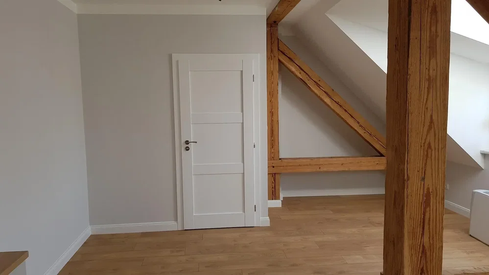 Kids room; wood beams, wood floor, natural light