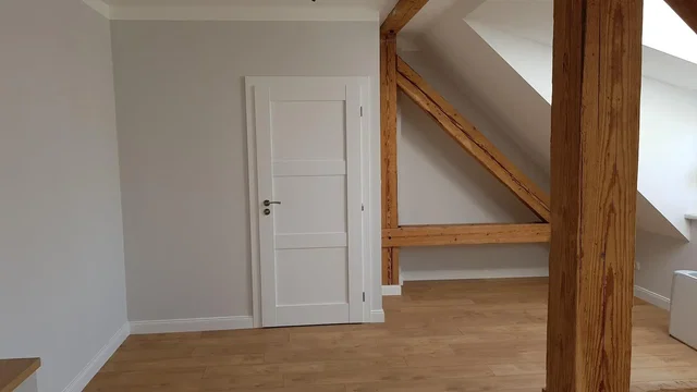 Kids room; wood beams, wood floor, natural light