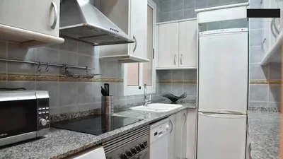 Kitchen; kitchen appliances, tile floor, renovated, natural light