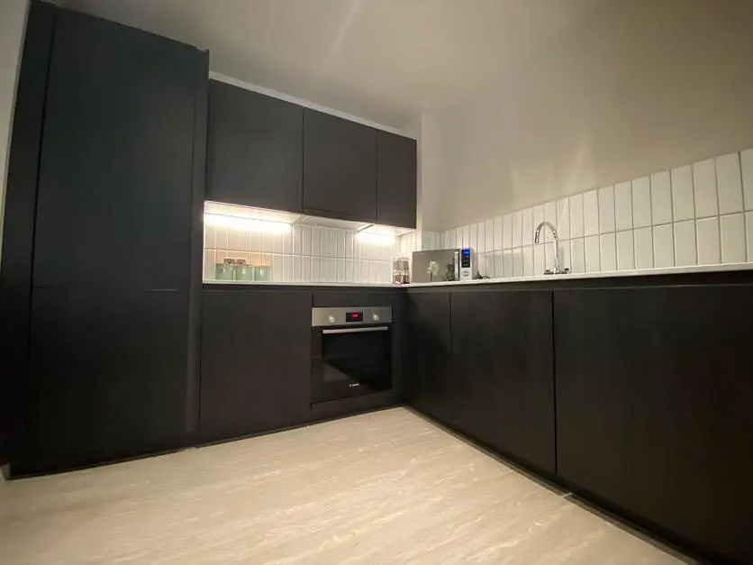 Kitchen; kitchen appliances, tile floor, wood floor