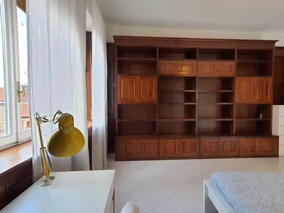 Bedroom; natural light, wood beams, wood floor