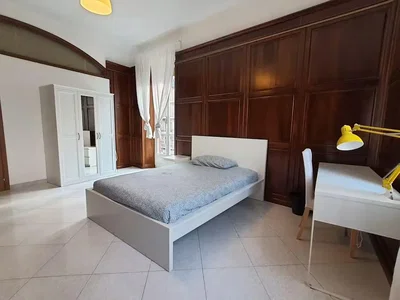 Bedroom; tile floor, natural light