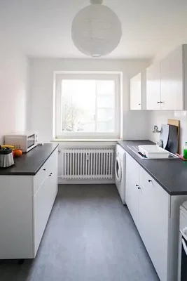 Kitchen; kitchen appliances, natural light, tile floor