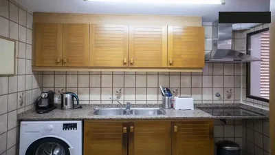 Kitchen; kitchen appliances, tile floor, needs renovation