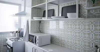 Kitchen; kitchen appliances, tile floor, natural light