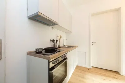 Kitchen; kitchen appliances, wood floor, natural light