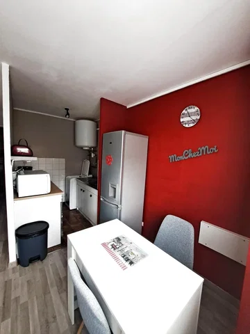 Kitchen; kitchen appliances, tile floor, wood floor, natural light