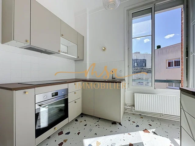 Kitchen; kitchen appliances, natural light, tile floor