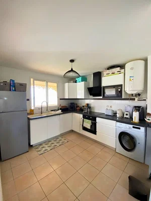 Kitchen; tile floor, kitchen appliances, natural light