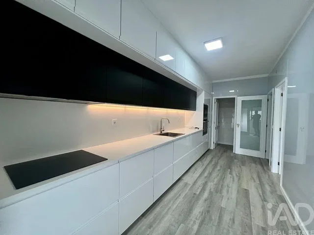Kitchen; kitchen appliances, wood floor, renovated, natural light