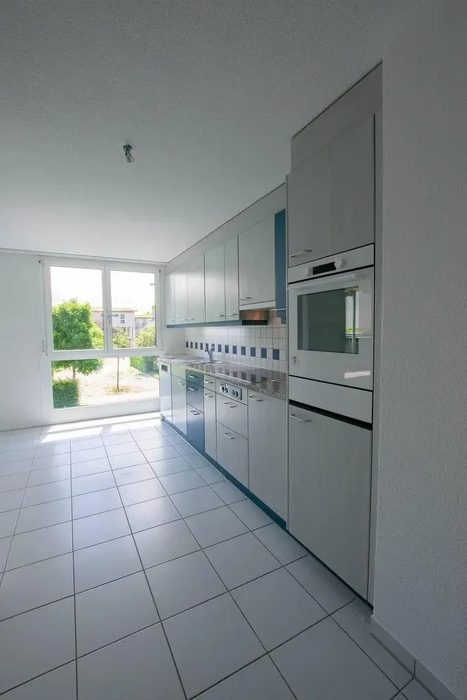 Kitchen; kitchen appliances, tile floor, natural light, view