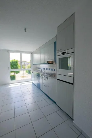 Kitchen; kitchen appliances, tile floor, natural light, view