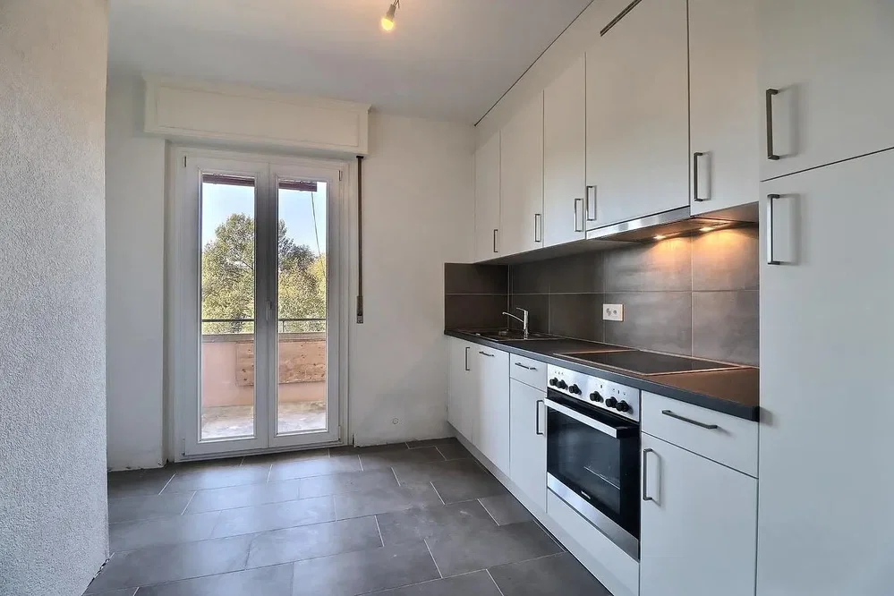 Kitchen; tile floor, kitchen appliances, natural light, view