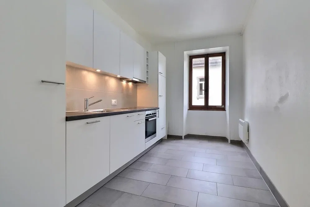 Kitchen; kitchen appliances, tile floor, natural light