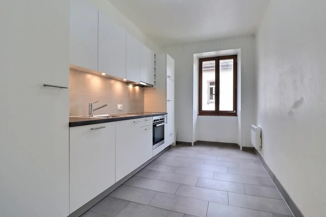 Kitchen; kitchen appliances, tile floor, natural light