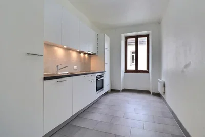 Kitchen; kitchen appliances, tile floor, natural light