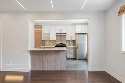 Kitchen; kitchen appliances, wood floor, natural light, renovated