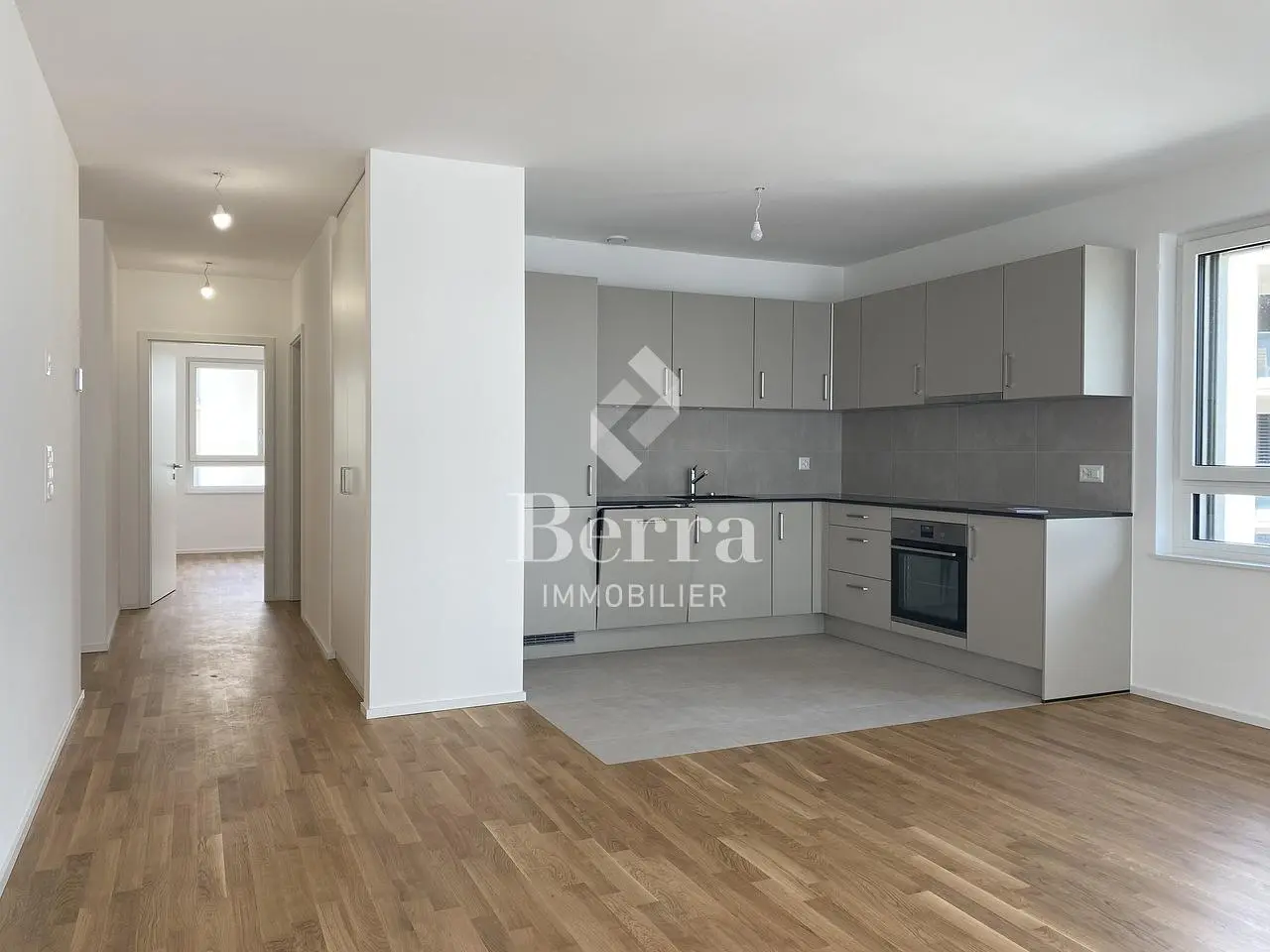 Kitchen; kitchen appliances, wood floor, natural light, renovated