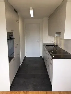 Kitchen; kitchen appliances, tile floor, natural light