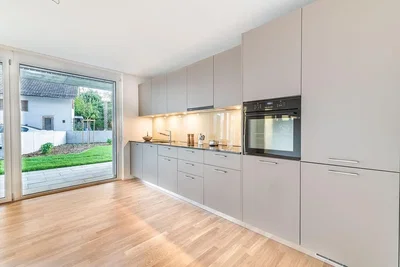 Kitchen; kitchen appliances, wood floor, natural light