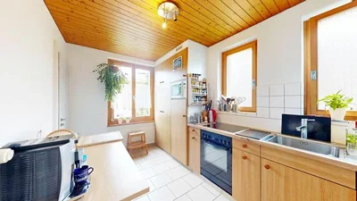 Kitchen; natural light, wood beams, tile floor, kitchen appliances