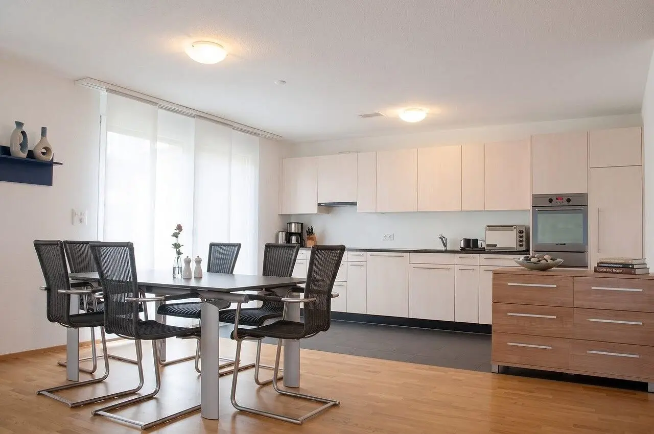 Kitchen; kitchen appliances, wood floor, natural light