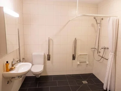 Toilet; tile floor, natural light