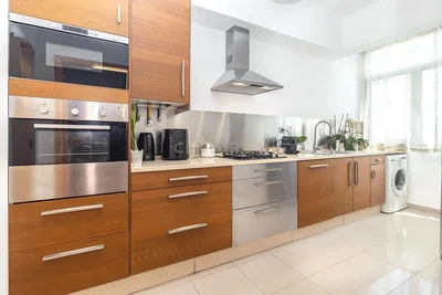 Kitchen; kitchen appliances, tile floor, natural light