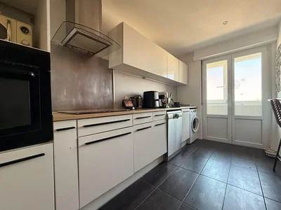 Kitchen; kitchen appliances, tile floor, natural light