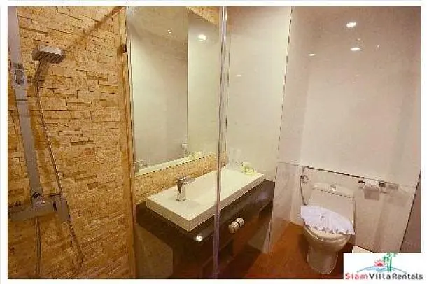 Toilet; tile floor, renovated, natural light