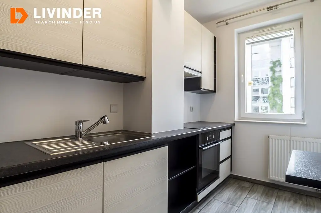 Kitchen; kitchen appliances, tile floor, natural light