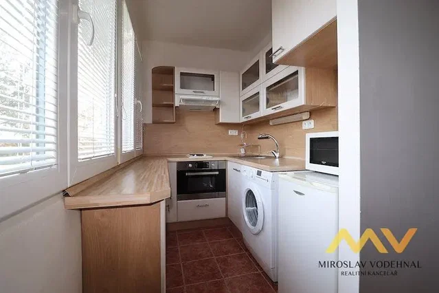 Kitchen; kitchen appliances, tile floor, natural light