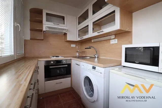 Kitchen; kitchen appliances, tile floor, natural light