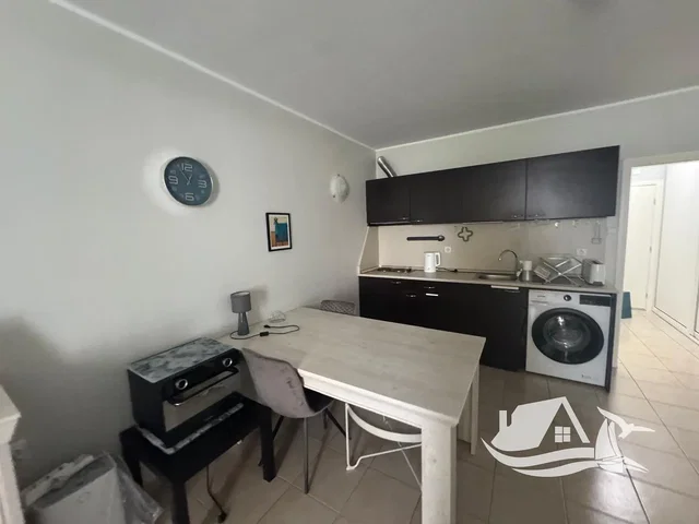 Kitchen; kitchen appliances, tile floor, natural light