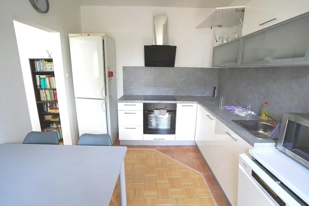 Kitchen; kitchen appliances, natural light, tile floor