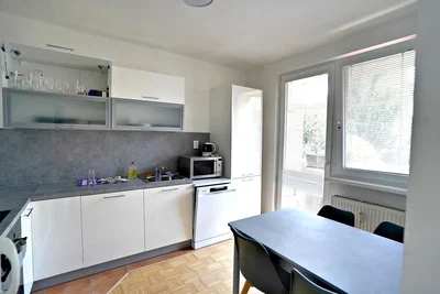 Kitchen; kitchen appliances, natural light, tile floor
