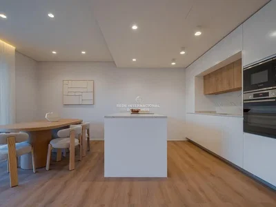 Kitchen; kitchen appliances, wood floor, natural light, modern style, renovated